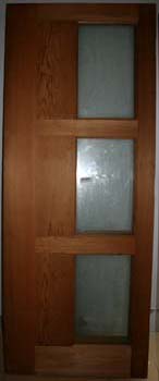 Interior of the Marrickville Joinery workshop with custom timber paneled door components during production.