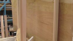 Close-up of a natural pale hardwood timber panel showing fine grain and texture — the quality timber materials used by Marrickville Joinery in custom joinery work. Natural Hardwood Timber Panel Close-Up