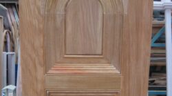 Close-up detail of an arched timber door corner, showcasing the precision joinery and quality craftsmanship of Marrickville Joinery.
