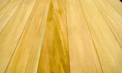 Natural timber planks showing fine grain, texture and wood character — the quality timbers selected by Marrickville Joinery for custom joinery projects. Natural Timber Plank Grain Detail