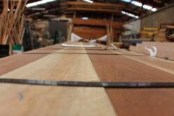 Marrickville Joinery workshop machinery processing custom timber components, demonstrating the precision machining capabilities of the workshop.
