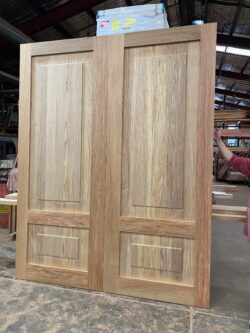 Traditional timber panel door in natural stained finish with classic raised panel design, crafted from quality hardwood at Marrickville Joinery.