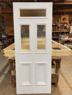 Custom white-painted six-panel timber door with obscure glass lite inserts, handcrafted in the Marrickville Joinery workshop.