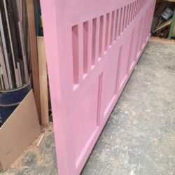 Long run of pink painted horizontal slatted louvre wall panels being manufactured in the workshop. Pink Painted Louvre Wall Panels