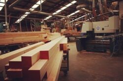 Assorted timber architrave and cornice moulding profiles stacked in the workshop, showing the range of heritage profiles available. Decorative Timber Moulding Profiles