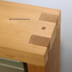 Close-up of a corrugated or grooved decorative timber panel surface, showing the detail of the machined profile. Textured Timber Panel Surface
