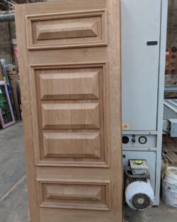 Solid timber heritage door with classic raised panel mouldings, showing a traditional design in excellent condition.