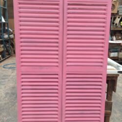 Pink painted louvre shutters or bi-fold shutter panels, suitable for heritage window and veranda installations. Pink Painted Louvre Shutters