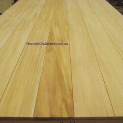 Wide flat solid timber benchtop or tabletop, showing the natural grain of the timber. Solid Timber Benchtop Surface