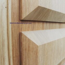 Close-up of a profiled timber moulding showing precise corner join, demonstrating the quality of heritage joinery craftsmanship. Timber Moulding Corner Detail