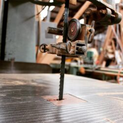 Low-angle view of the workshop floor and machinery, showing the working environment from an artistic perspective.