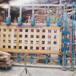 Horizontal storage of timber rods, dowels or lengths in the workshop, organised in a rack system for easy access.