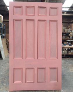 Pink painted traditional six-panel heritage door, showing the classic panel arrangement used in Victorian and Federation-era homes.