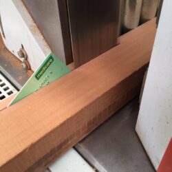 Close-up of a timber moulding or cornice corner joint, demonstrating the precision of heritage joinery corner construction.
